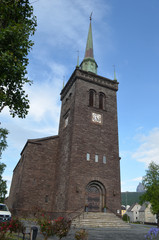 Fototapeta na wymiar Narvik church building in between trees