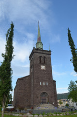 Fototapeta premium Narvik church building in between trees