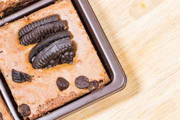 Homemade brownies sliced and  topping on  wooden background