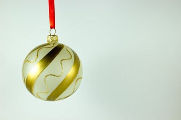 Christmas ball with red ribbon