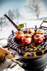 Tuinposter Tasty stuffed apples roasting on a grill © exclusive-design