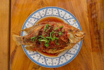 Fried Fish with Chili Sauce on the plate, Thai food.