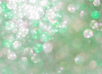 Holiday abstract green glitter defocused background with blinkin