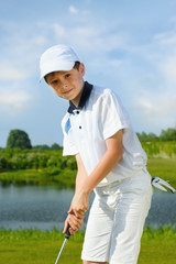 Boy playing golf