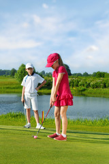 Kids playing golf