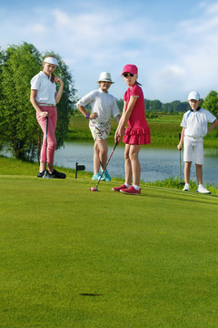 Kids playing golf