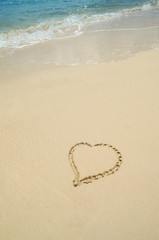 Heart Drawn in Sand on The Beach with Copy Space
