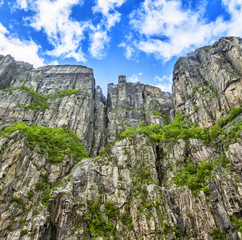 Fototapeta na wymiar View up a gigantic rock in Lysefjord, famous as Preikestolen - or pulpit rock, Norway.