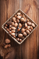 Mixed nuts on a wooden background