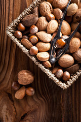 Mixed nuts on a wooden background