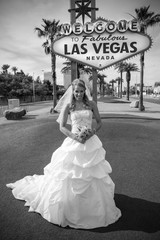 Bride at the Las Vegas sign. Black and white photo.