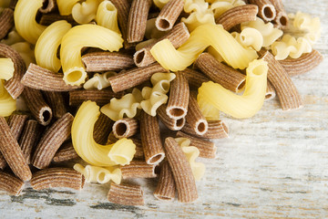 Raw pasta on table