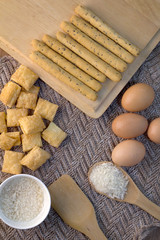 Different fresh bread on beige fabric