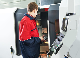 worker at machining tool workshop