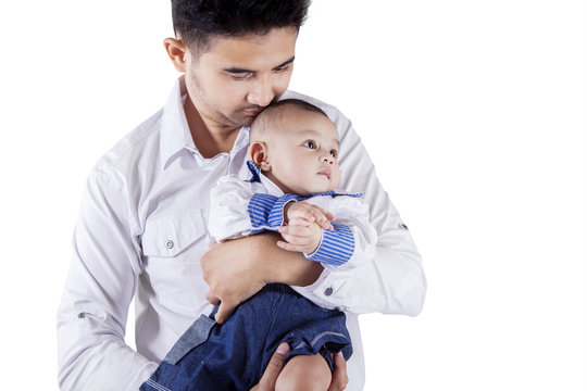 Young Man And His Baby In Studio