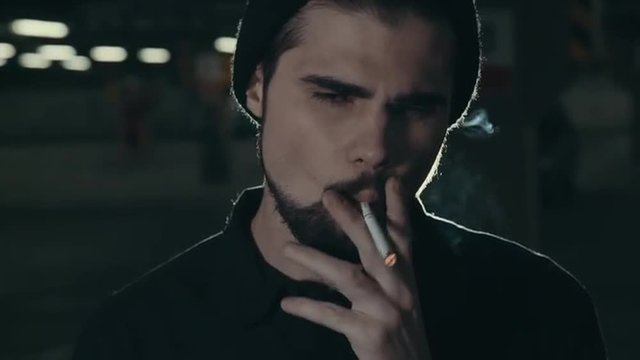 Young Handsome Bearded Man Smoking Cigarette 