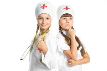 Smiling girls doctor with stethoscope in uniform standing