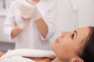 Obraz na płótnie Canvas Professional expert beautician is serving her patient