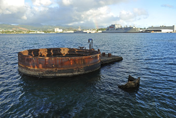 Hull of the USS  Arizona lies just below the surface of Pearl Harbor.  Still bleeding oil since sunk by Japanese fighter bombers December 7, 1941.