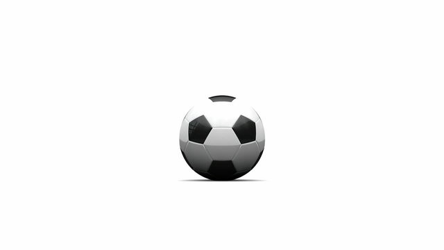 : A regular black and white soccer ball being slightly kicked by an invisible force and rolling on an isolated white surface towards the camera