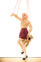 woman girl stylized like marionette puppet on string