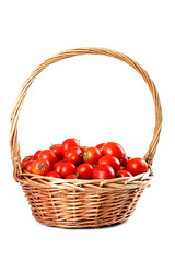 Fresh red tomatoes in basket isolated on white