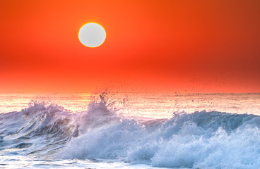 Wave breaking at sunrise