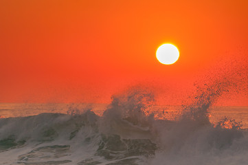 Wave breaking at sunrise