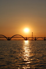 Bridge over the river at sunset. Dnieper river, Ukraine.