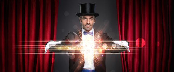 magician showing trick - obrazy, fototapety, plakaty