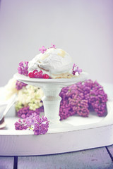 Obraz na płótnie Canvas Beautiful composition with tasty ice cream and lilac flowers