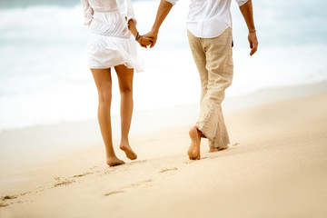 Back view of a barefoot couple