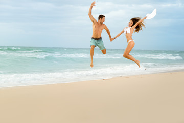 Fototapeta na wymiar Happy couple on beach