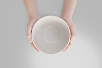 Empty plate in hand isolated.