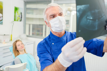 Dentist holding up an x-ray