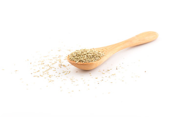 Dried rosemary leaves in wooden spoon
