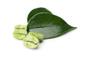Green coffee beans with leaves isolated on white