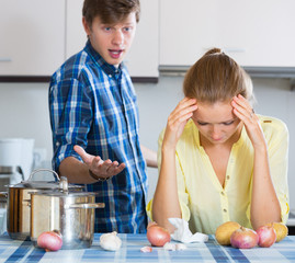 man and frustrated housewife having bad argument