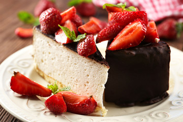 Delicious cheesecake with berries on table close up