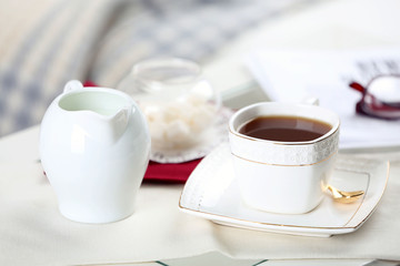 Fototapeta na wymiar Cup of tea on table in living room