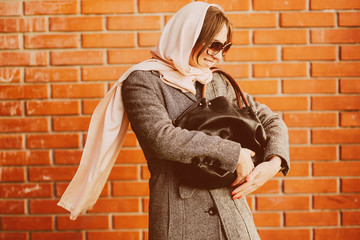 girl in a coat on the street