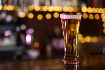 Cold beer glass on bar or pub desk