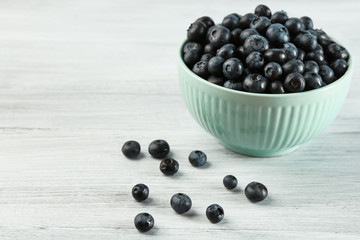Fresh blueberries in bowl on table close up