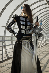 Fototapeta na wymiar Futuristic girl holding a blade