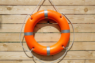 A life buoy on wooden background
