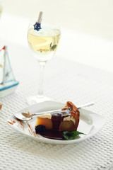 Delicious cake under chocolate glaze with blackberry and mint