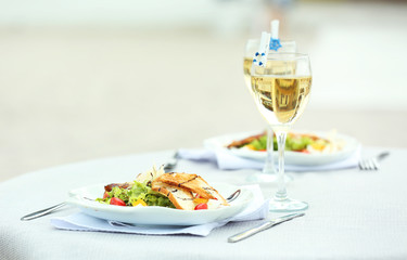 Tasty salad on white served table