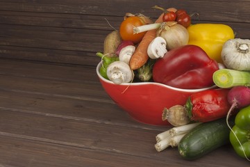Various types of vegetables on an old wooden table. The concept of diet food. Food for obese patients. Autumn harvest vegetables. Growing fresh home-grown vegetables
