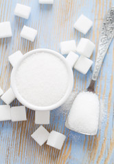 white sugar cubes on wooden surface