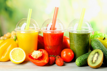 Fresh juice mix fruit, healthy drinks on wooden table, on bright background